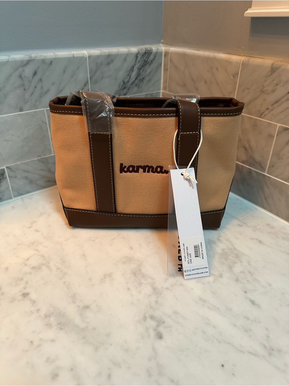 Karma Beige Canvas Duffel with Brown Trim